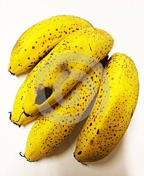 Rotten bad yellow bananas with shadow background