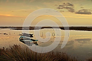 Rotten fishing boats by the river