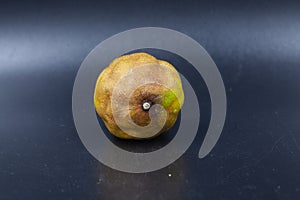 Rotten lime fruit on seen from above on a dark background photo