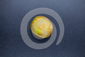 Rotten lime fruit on seen from above on a dark background photo