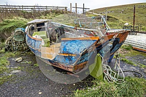 Rotten old boat wreck in scottish harbour