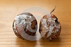 Rotten passion fruits on wood table