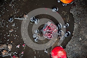 Rotten pomegranates and grapes