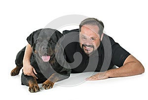 Rottweiler and man in studio