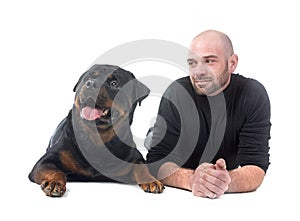 rottweiler and man in studio