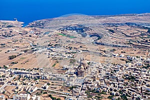 The rotunda of Xewkija, Casal Xeuchia is the largest in Gozo and its dome dominates the island everywhere. Mgarr ix-Xini bay. photo