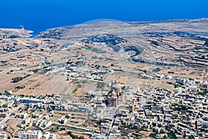 The rotunda of Xewkija is the largest in Gozo and its dome dominates the island everywhere. Aerial view of Malta.
