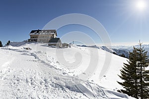 Rotwandhaus shelter in the bavarian alps with blue sky and sun