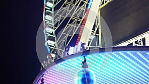 Roue de Paris French sign with changing lights at gleaming Big Wheel entrance