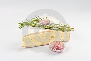 Rougette cheese with fresh rosemary and garlic isolated on white background