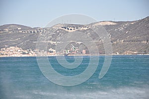 Rough Adriatic Sea and Bura wind in Bakar gulf.Panoramic view of Bakar city. photo