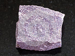 rough Alunite stone on dark background