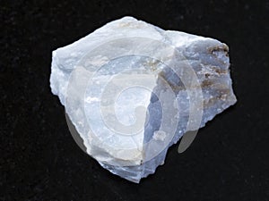 rough Angelite (Blue Anhydrite) stone on dark photo