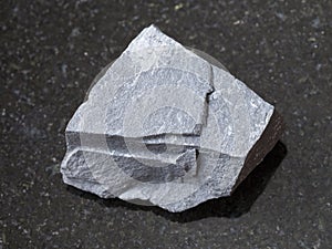 rough argillite stone on dark background