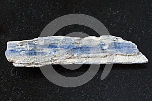rough blue kyanite stone on dark