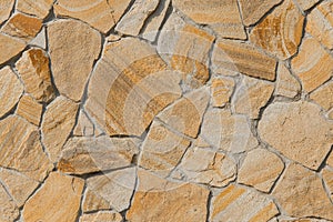 Rough brown stone texture abstract mosaic pattern floor wall rock background solid seamless structure backdrop coarse old
