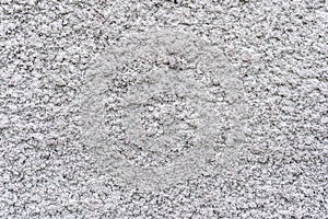 Rough bumpy texture of the concrete