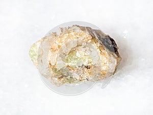 rough chrysoberyl (green beryl) crystal on white