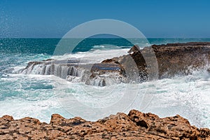 Rough coast line wave spray at Quobba Blow Holes Western Australia