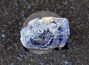 rough Cordierite (Iolite) crystal on black