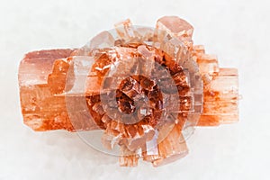 rough crystal of Aragonite stone on white marble