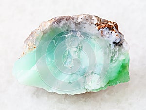 rough crystal of Chrysoprase gemstone on white
