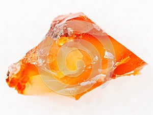 rough crystal of cornelian (chalcedony) on white photo