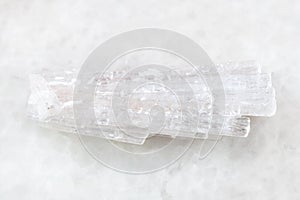 rough crystal of Scolecite gemstone on white photo