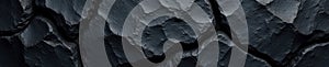 Rough, dark, black stone surface Deep crevices, matte finish , texture, crevices