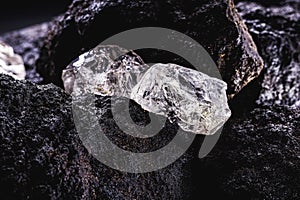 Rough diamond  precious stone in mines. Concept of mining and extraction of rare ores photo
