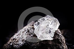 Rough diamond  precious stone in mines. Concept of mining and extraction of rare ores