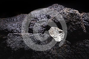 Rough diamond  uncut gemstone  mine bottom. Concept of mining and extraction of rare ores