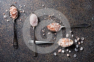 Rough and fine pink Himalayan sea salt on vintage spoons