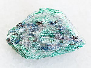 rough Fuchsite (chrome mica) stone on white marble