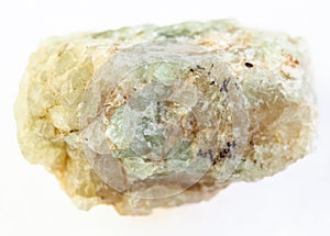 rough green beryl (chrysoberyl) stone on white