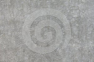 Rough grey concrete cement wall or flooring pattern surface texture. Close-up of exterior material for design decoration