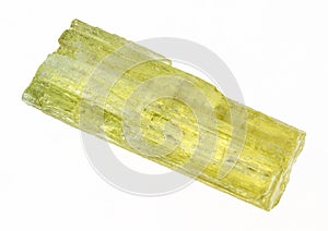 rough heliodor (yellow beryl) crystal on white