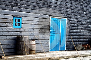 Rough house and old oak barrel.