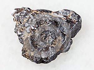 rough Ilmenite stone on white photo