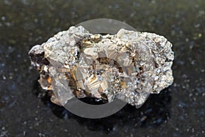 rough iron pyrite stone on dark background