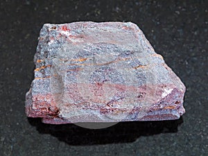 rough jaspilite (ferruginous quartzite) on dark