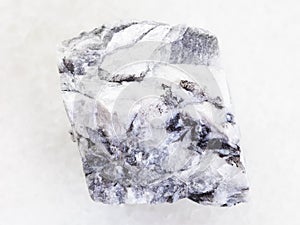 rough magnesite stone on white marble