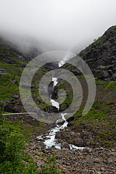 Rough mountain sides around the Trollstigen mountain pass that twists through 11 hairpin bends up the steep mountains of Romsdalen