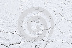 Rough old plaster on a brick wall. White gray abstract background