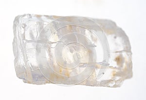 rough petalite (castorite) gem stone on white photo