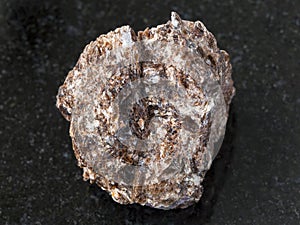 Rough Phlogopite stone on dark background