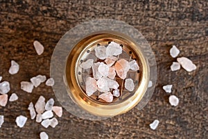 Rough pink Himalayan sea salt on an incense burner