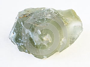 rough prase (prasiolite) stone on white