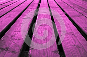 Rough purple pink or purplish pinkish violet wooden stage background with low depths of field