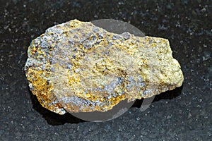 rough pyrite ore on dark background